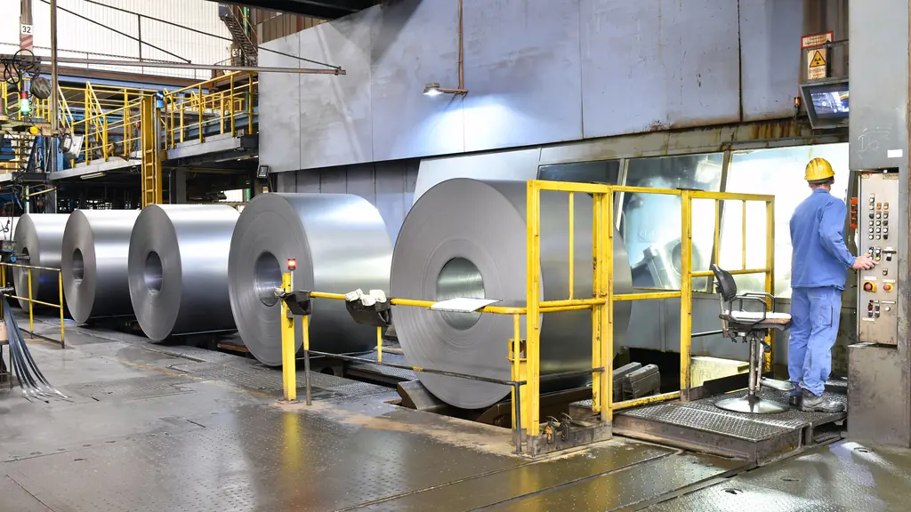 Operator running a steel coil processing line